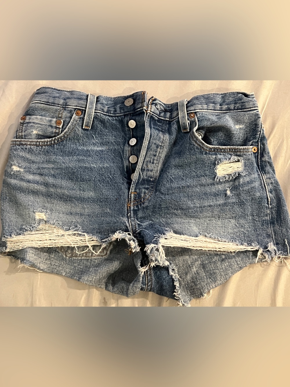 Levi's Distressed Button-Fly Denim Shorts in Light Blue